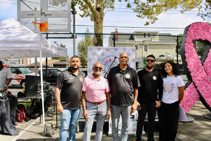 Members of the NYPD DESI Society, with emcee Raquel Baldeo, far right, supported the Queens Cancer Walk at its 11th annual celebration at Smokey Oval Park on Sept. 19.