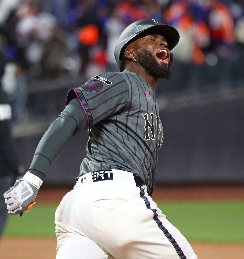 New York Mets center fielder Luis Robert Jr. celebrating after hitting a walk-off home run.