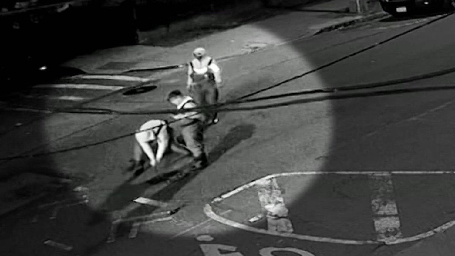 New video shows a group wearing hip waiters and carrying flash lights as they pry open a manhole cover on May 5th just before 2 a.m. in Astoria. (AKI Autocare)