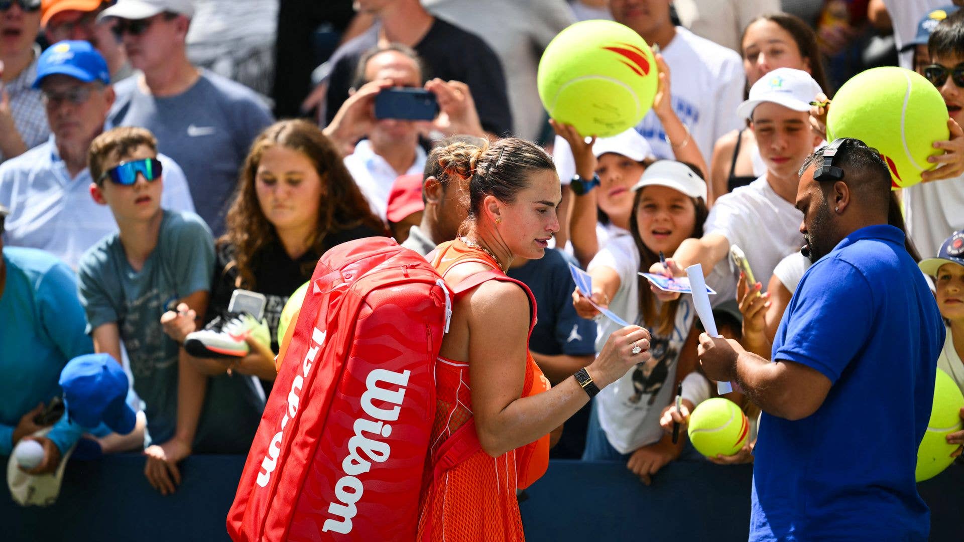 Belarus's Aryna Sabalenka greets people and sign autographs after defeating Uzbekistan's Kamilla Rakhimova during their women's singles third round tennis match on day six of the US Open tennis tournament at the USTA Billie Jean King National Tennis Center in New York City on September 4, 2026. 