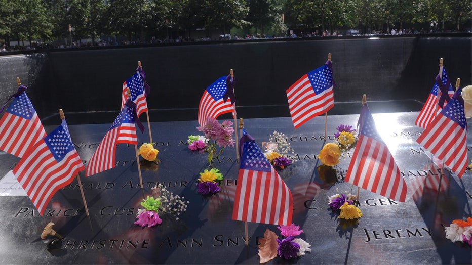 NEW YORK, UNITED STATES - SEPTEMBER 11: A grave is seen the commemoration ceremony on the 23rd anniversary of the September 11 terror attack on the World Trade Center around South Tower Memorial Pool in New York City, United States on September 11, 2024. Despite the presence of top political figures such as US President Joe Biden, Vice President and Democratic presidential candidate Kamala Harris and Republican presidential candidate Donald Trump, Americans did not show as much interest as in previous years. Firefighters and Christian missionary groups, who were among the groups that lost the most lives in the attacks in New York, also participated heavily in the ceremonies this year. (Photo by Selcuk Acar/Anadolu via Getty Images)
