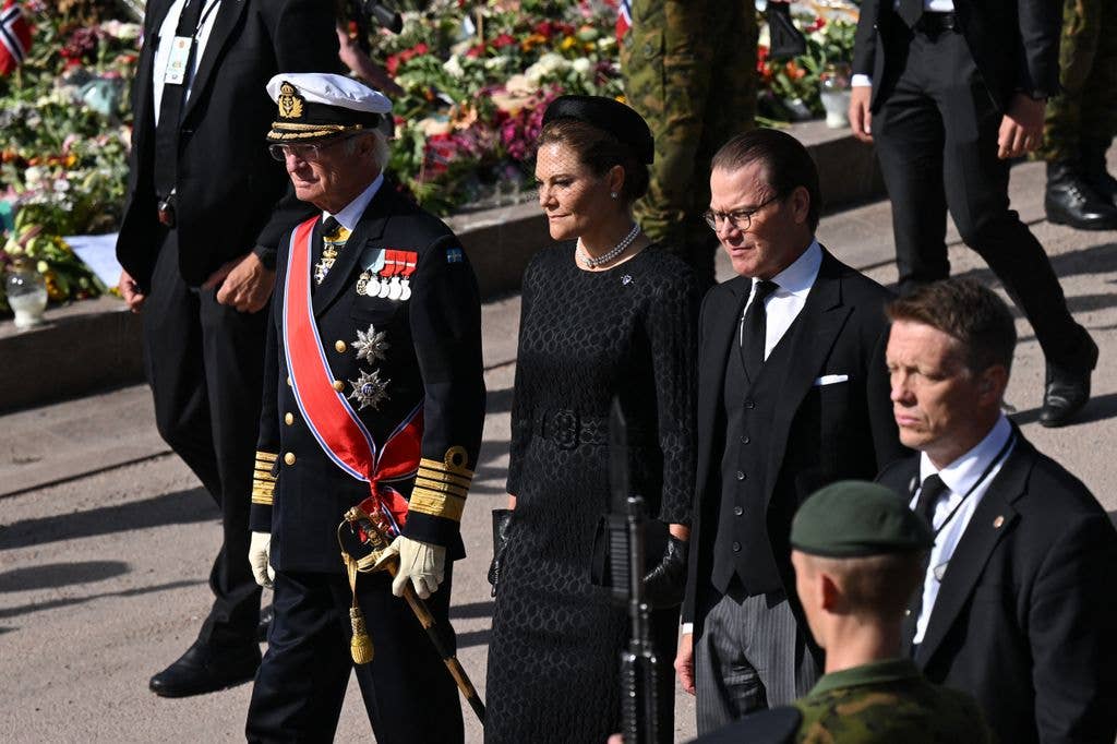 Sweden's King Carl XVI Gustaf, Crown Princess Victoria of Sweden and Crown Prince Daniel of Sweden walk during the royal procession accompanying the casket of late King Harald V of Norway