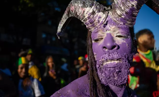 People participate in J'Ouvert festivities ahead of the West Indian Day Parade at sunrise on Labor Day in the Crown Heights and Flatbush neighborhoods of Brooklyn, Monday, Sept. 7, 2026, in New York. (AP Photo/Angelina Katsanis)