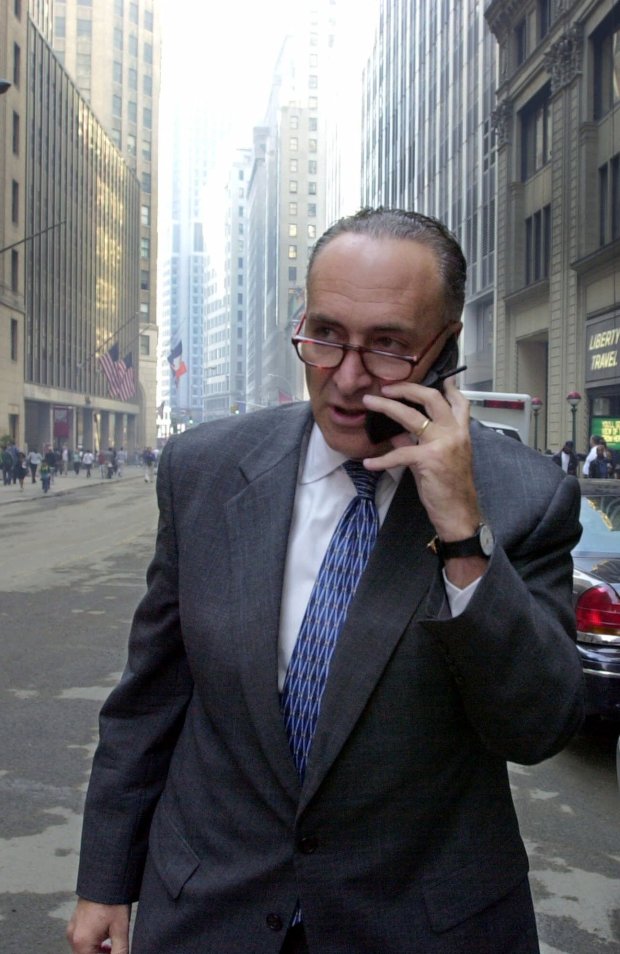 Sen. Charles Schumer, D-N.Y., talks on his cell phone Monday, Sept. 17, 2001, on his way to opening ceremonies at the New York Stock Exchange. Wall Street ended its longest shutdown since the Great Depression and resumed trading Monday for the first time since last Tuesday's terrorist attack. (AP Photo/Charles Rex Arbogast)