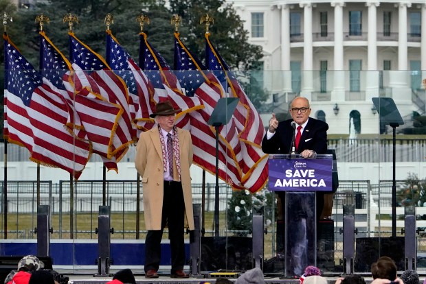 Chapman University law professor John Eastman stands at left as former New York Mayor Rudolph Giuliani speaks in Washington at a rally in support of President Donald Trump, called the "Save America Rally," on Jan. 6, 2021. (AP Photo/Jacquelyn Martin, File)