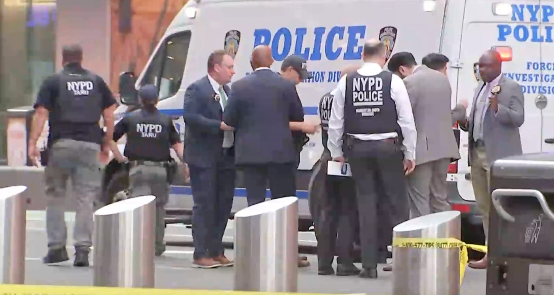 This image made from video provided by WABC shows NYPD officers on the scene after a woman brandishing two large knives was shot by officers in Times Square in New York, Monday, Aug. 31, 2026. (WABC via AP)