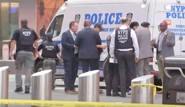 This image made from video provided by WABC shows NYPD officers on the scene after a woman brandishing two large knives was shot by officers in Times Square in New York, Monday, Aug. 31, 2026. (WABC via AP)