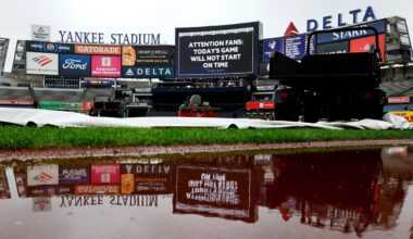 A game delay announcement is shown on the scoreboard before a scheduled baseball game between the New York Yankees and the Baltimore Orioles, Sunday, Sept. 27, 2026, in New York. (AP Photo/Noah K. Murray)
