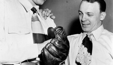 Ralph Branca, left, tries out the glove of teammate Eddie Stanky, right, Feb. 17, 1948, in Mobile, Ala. Photo: AP