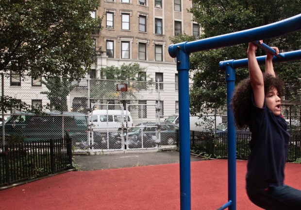 Nicholas Gayles, 6, a student at P.S. 75, plays in the school's playground on 95th St. in Manhattan on Wednesday, Oct. 3, 2012 in New York City. (AP Photo/Bebeto Matthews)