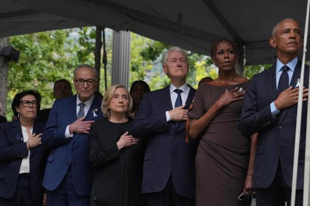 Iris Weinshall, Senate Minority Leader Chuck Schumer, D-N.Y., former Secretary of State Hillary Clinton, former President Bill Clinton, former First Lady Michelle Obama, former President Barack Obama attend a ceremony commemorating the 25th anniversary of the Sept. 11, 2001 attacks at the National September 11 Memorial in New York on Friday, Sept. 11, 2026. (Hiroko Masuike /The New York Times via AP, Pool)