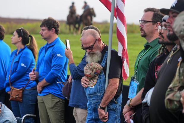 Visitors to the Flight 93 National Memorial in Shanksville, Pa., attend an observance, Friday, Sept.11, 2026, as the nation marks the 25th anniversary of the Sept. 11, 2001, attacks. (AP Photo/Gene J. Puskar)