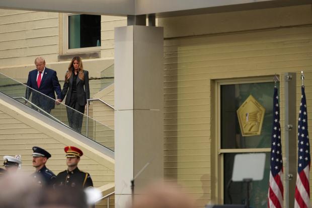 President Donald Trump, left, and first lady Melania Trump arrive at an observance ceremony on the 25th anniversary of the 9/11 attacks, Friday, Sept. 11, 2026, at the Pentagon in Washington. (AP Photo/Mark Schiefelbein)