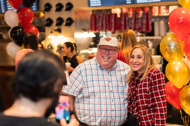 Marty Mallit, a contest winner, is all smiles for a photo with Original Carnegie Deli Daughter and Second Generation Marian Harper during the opening day of Carnegie Deli Tuesday, Sept. 15, 2026.