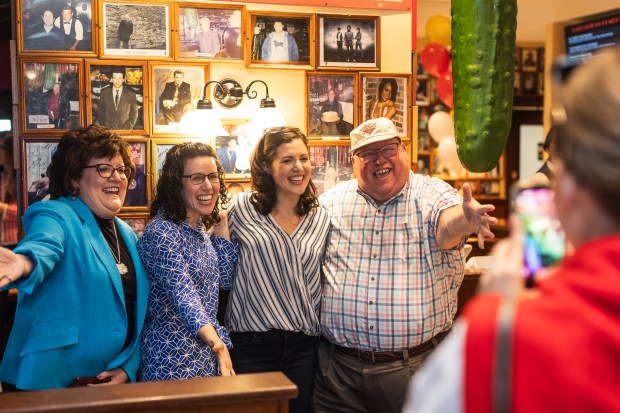 Marty Mallit (R), a contest winner, is all smiles for a photo during the opening day of Carnegie Deli Tuesday, Sept. 15, 2026.