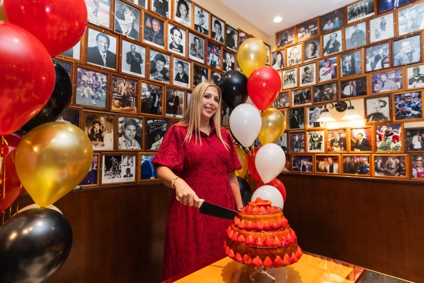 Third Generation Owner and Carnegie Deli Brand CEO Sarri Harper is seen cutting the cheesecake during the opening on Tuesday, Sept. 15, 2026.