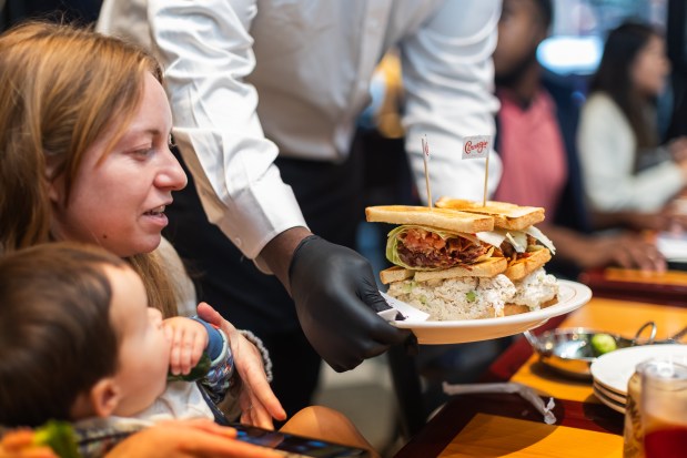 Customers enjoy their meal during the opening of Carnegie Deli on Tuesday, Sept. 15, 2026.