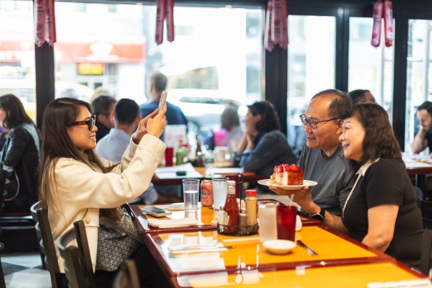 Customers enjoy their meal during the opening of Carnegie Deli on Tuesday, Sept. 15, 2026.