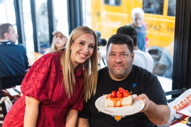 First customer to arrive with Third Generation Owner and Carnegie Deli Brand CEO Sarri Harper pose for a photo on Tuesday, Sept. 15, 2026.