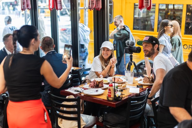 Girls Gotta Eat podcaster and comedian Rayna Greenberg and Food Influencer Jeremy Jacobowitz are seen at the opening of Carnegie Deli Tuesday, Sept. 15, 2026.