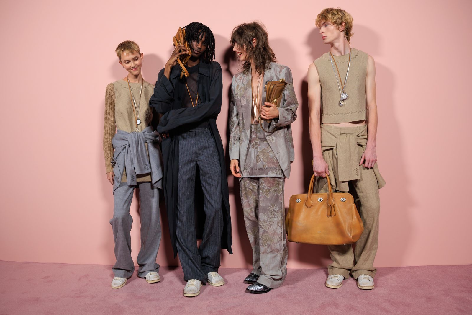 Image may contain Benjamin Stone Accessories Bag Handbag Clothing Pajamas Purse Formal Wear Suit Adult and Person