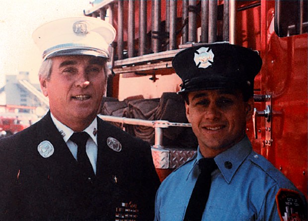 FDNY Chief Ray Downey (left) and his son, Joseph, as a probationary firefighter. (FDNY)