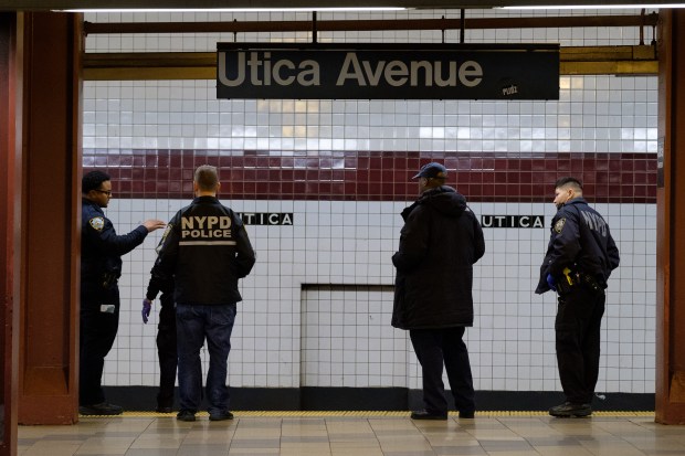 FILE - Police investigate after a person was fatally struck by a train at the Utica Avenue A/C subway station in Brooklyn, New York on Tuesday, Jan. 7, 2020. (Gardiner Anderson for New York Daily News)