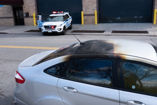 A burned car is pictured on Court St. and Bay St. in Red Hook, Brooklyn, on Saturday, Feb. 8, 2020. Douglas Young was found dead inside. (Gardiner Anderson for New York Daily News)