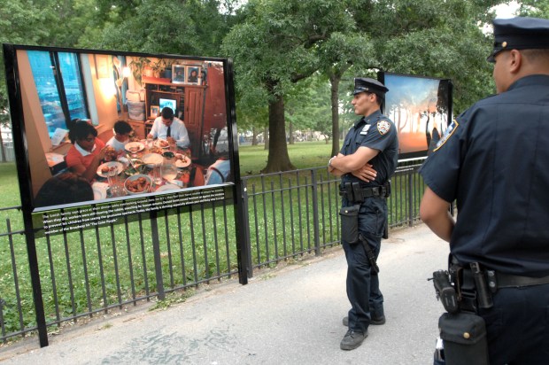 ROP -- Installation of the 'Milestones to Recovery' exhibit inside Battery Park - the photo exhibition by Daily News staff photographer Susan Watts celebrates the rebirth and revitalization of Lower Manhattan since the World Trade Center attacks. Exhibition opens on Thursday the 28th of June and hangs until September 30th. Monday afternoon in Manhattan {6-25-07}