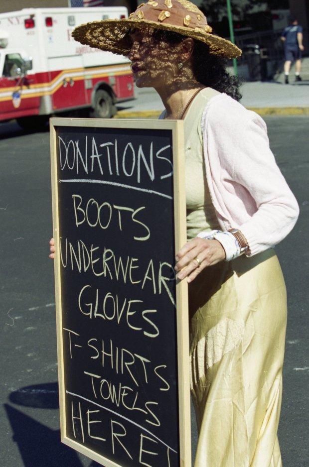 A volunteer asks for donations outside St. Vincent's Hospital after the 9/11 attacks on Sept. 13, 2001. (Kristen Artz for New York Daily News)