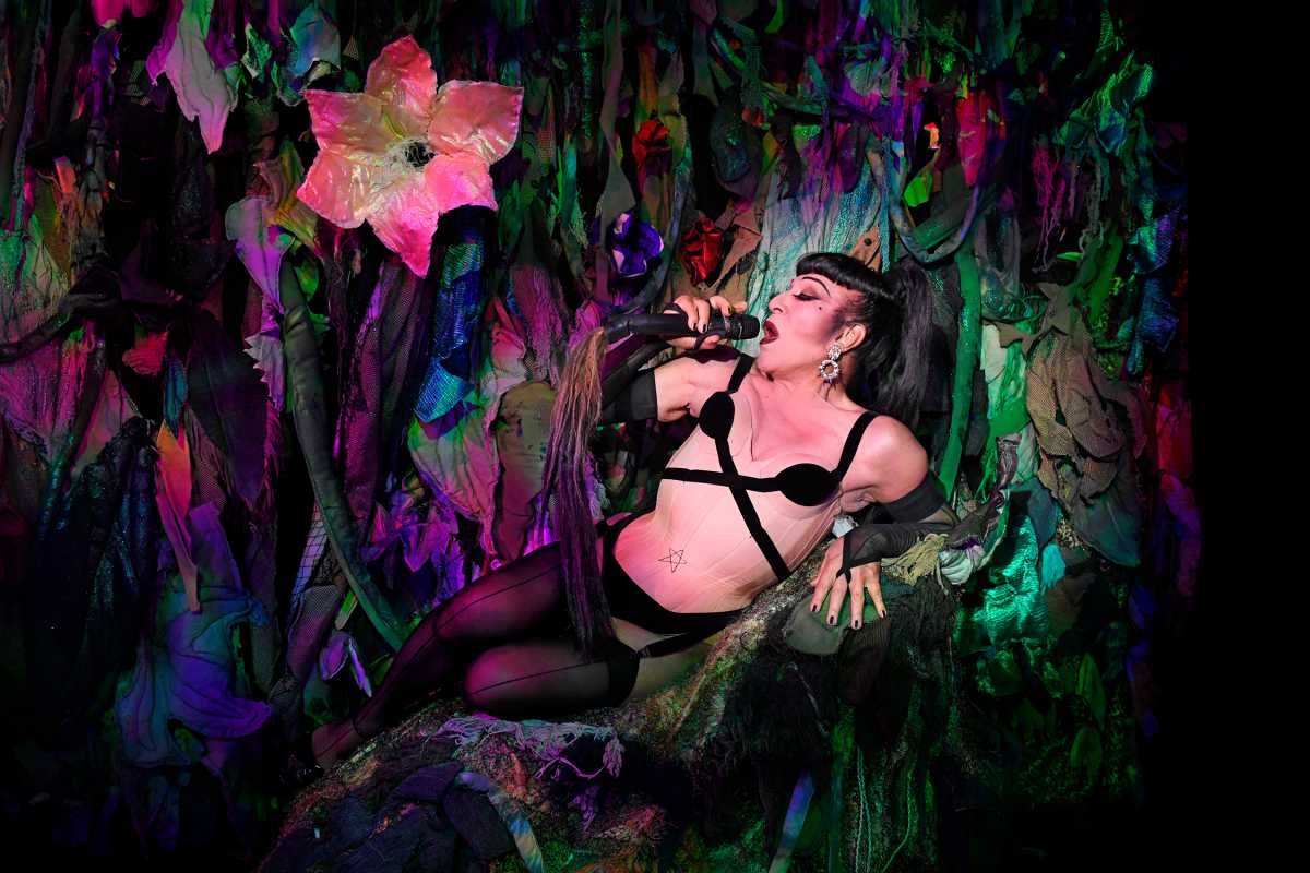 Joey Arias  in the garden. Costume concept by Thierry Mugler