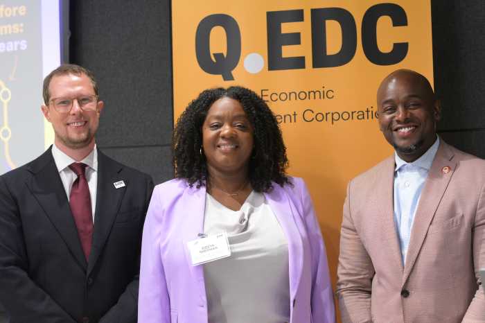 Riley and Sherman pose with Guttmann after Tuesday's conference. Photo by Ramy Mahmoud.