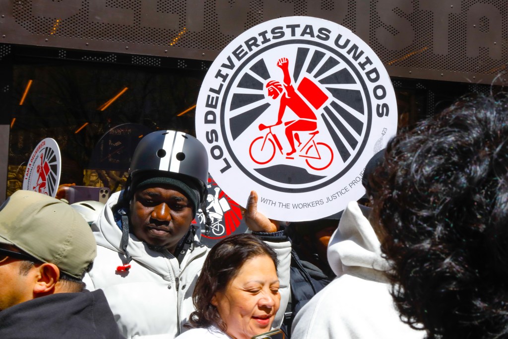 Delivery workers celebrate the opening of the Deliverista Hub at City Hall Park
