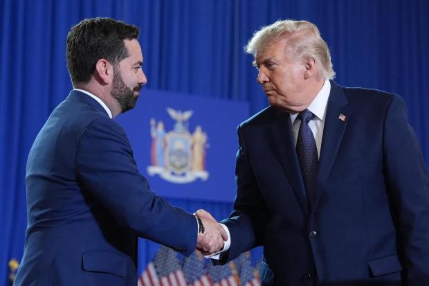 President Donald Trump shakes hands with Rep. Mike Lawler, R-N.Y.