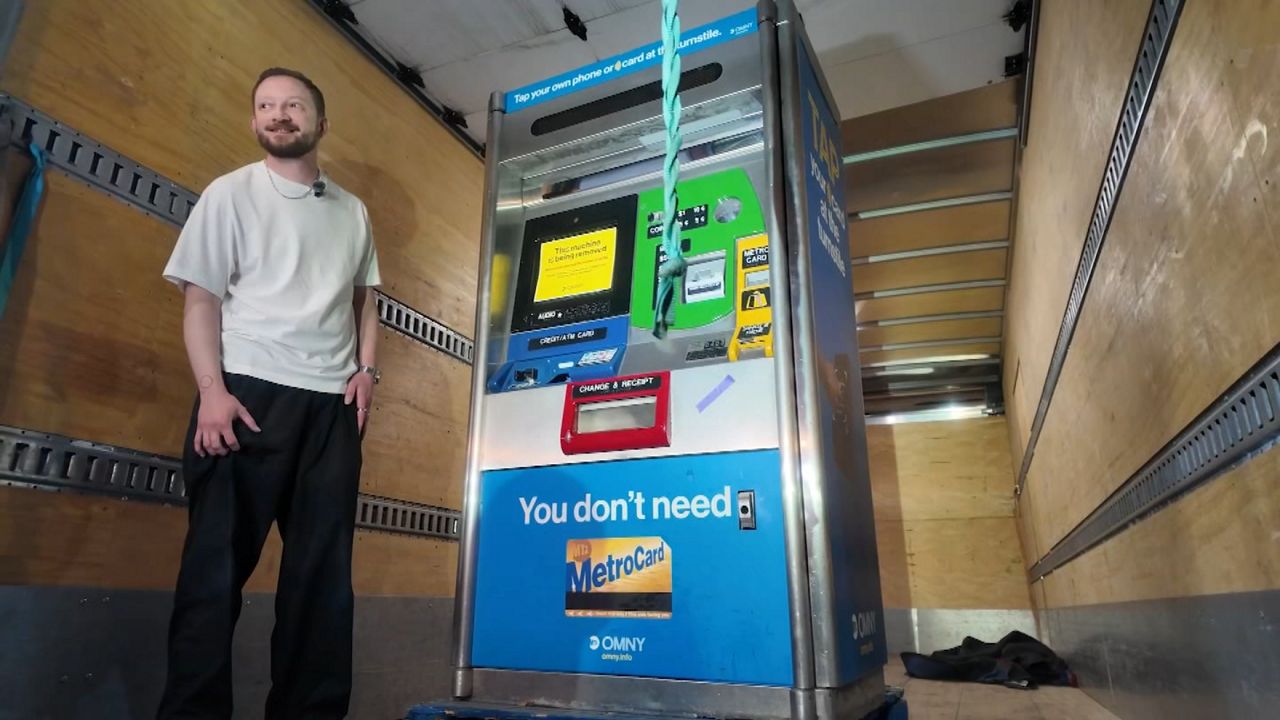 MetroCard machine winners collect their items in Queens