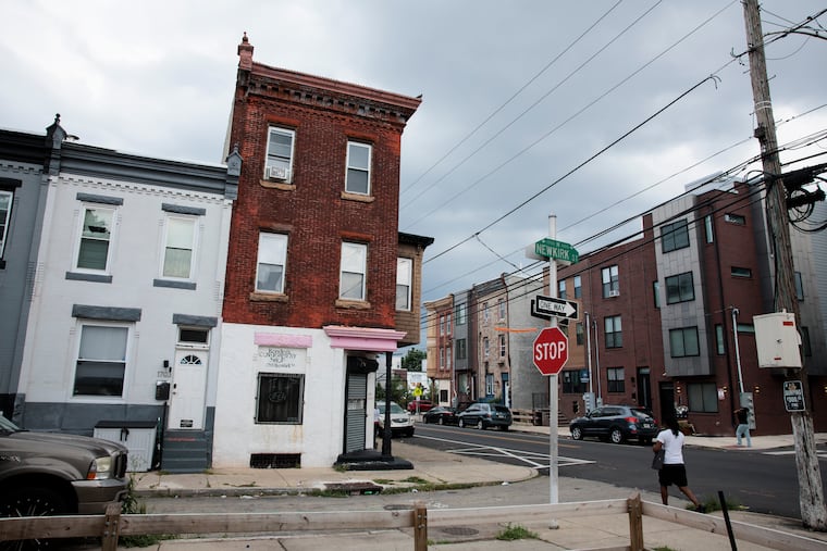 Classic rowhouses sit alongside homes built more recently near the 1700 block of North Newkirk Street in Philadelphia. Zillow says New Yorkers want to move to the Philly area.
