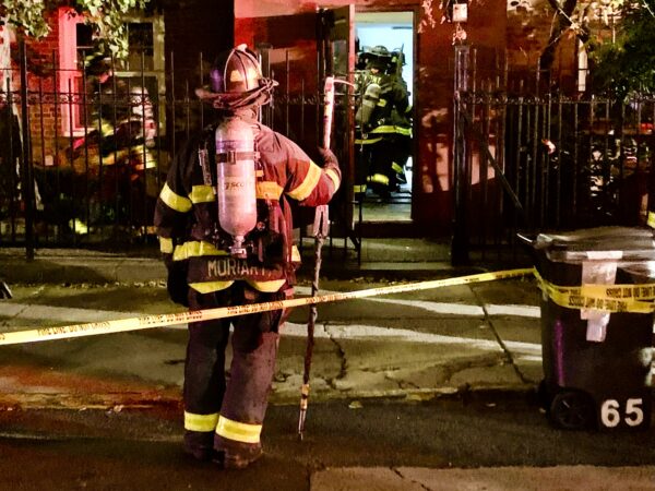 Firefighters rush in to 65 Middagh St. after carbon monoxide gas was detected Saturday night. Photo: Mary Frost/Brooklyn Eagle