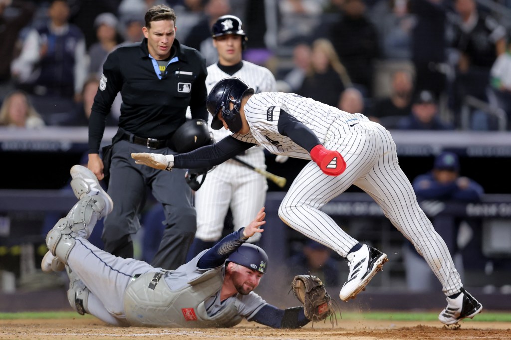 George Lombard Jr. avoids Liam Hicks tag attempt on an inventive slide to score a run in the seventh inning of the Yankees-Rays game on Sept. 24, 2026 in The Bronx.