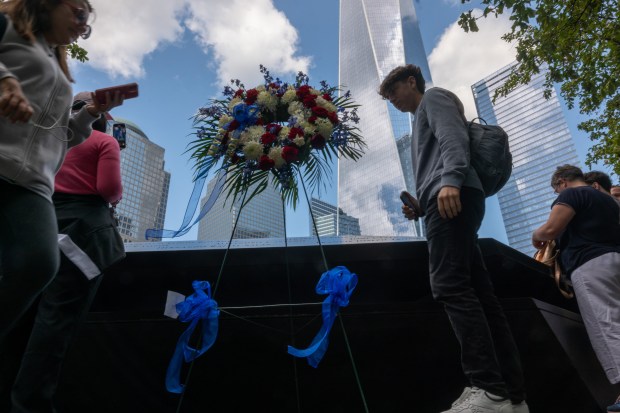 People visit the September 11 Memorial and Museum.