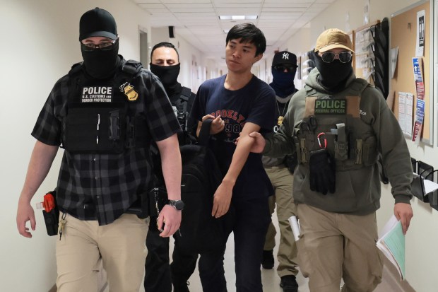 NEW YORK, NEW YORK - JULY 23: Federal agents detain a man as he exits immigration court after a hearing at the Jacob K. Javits Federal Building on July 23, 2025 in New York City. NYC Comptroller Brad Lander and NYC Public Advocate Jumaane Williams visited immigration court to witness active proceedings as detention of immigrants attending court hearings continue. The lawmakers also attempted to gain access to inspect the 10th floor of 26 Federal Plaza after a video was leaked earlier this week where the Immigration and Customs Enforcement (ICE) agency has been holding detainees since ICE stepped up arrests this summer. Immigrants who have been detained have complained about overcrowded and unsanitary conditions inside the holding cells. (Photo by Michael M. Santiago/Getty Images)