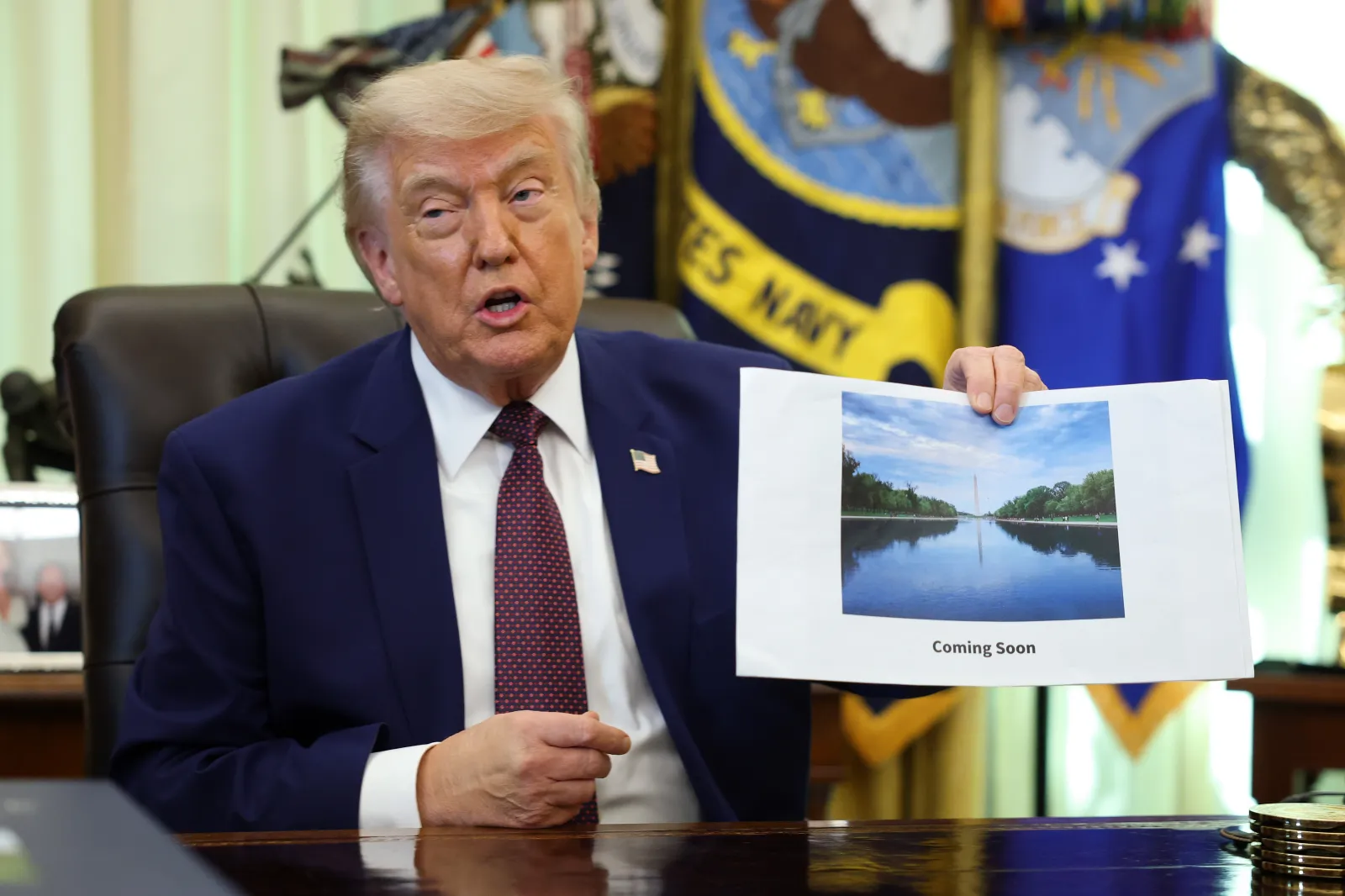 President Donald Trump displays a rendering of his proposed renovations to the Lincoln Memorial Reflecting Pool during an event in the Oval Office of the White House on June 03, 2026 in Washington, DC.