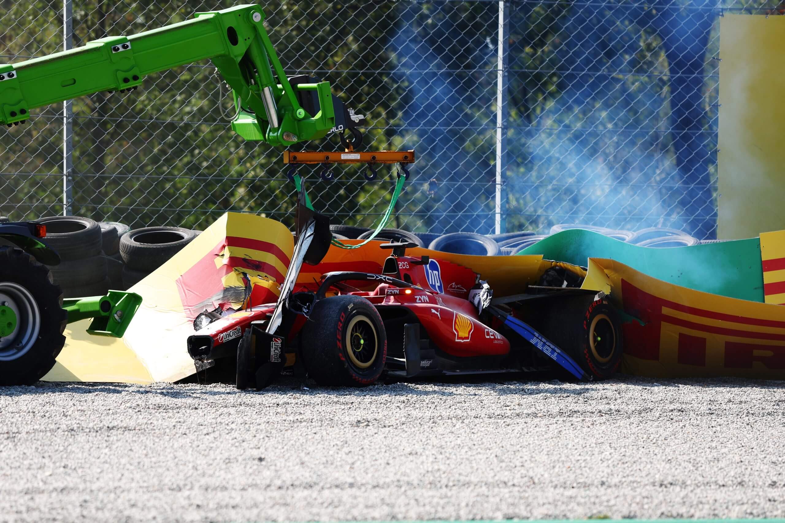 Charles Leclerc's Ferrari in the barriers
