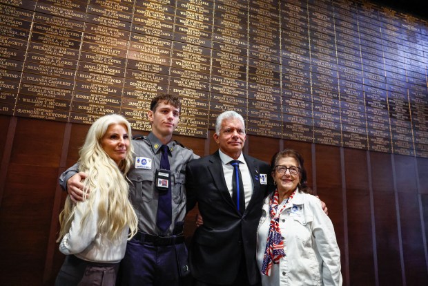 Family members of first responders stand by the new 9/11 Memorial Wall at One Police Plaza in New York, on Sept. 9, 2026. (Photo by kena betancur / AFP via Getty Images)