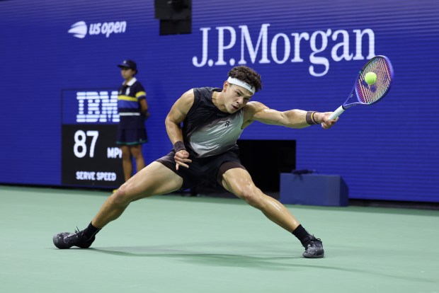 Ben Shelton returns a shot against Frances Tiafoe during their Men's Semifinal match on Friday.