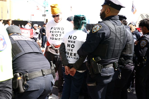 New York City Police Department (NYPD) officers detain pro-Palestinian demonstrators who were blocking First Avenue near the United Nations headquarters building, ahead of Israel's Prime Minister Benjamin Netanyahu's address to the 81st United Nations General Assembly in New York on September 24, 2026. (Photo by CHARLY TRIBALLEAU / AFP via Getty Images)