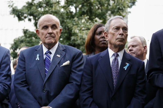 (R-L) Former New York Mayors Michael Bloomberg and Rudy Giuliani attend the 14th Anniversary ceremony of the terrorist attacks at the 9/11 memorial on Sept. 11, 2015 in New York. (KENA BETANCUR/AFP via Getty Images)