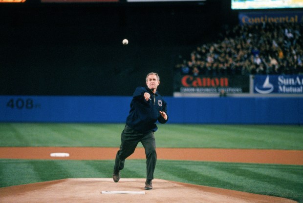George W. Bush throws the ceremonial first pitch before Game 3 of the 2001 World Series. (Photo by Rich Pilling/MLB via Getty Images)