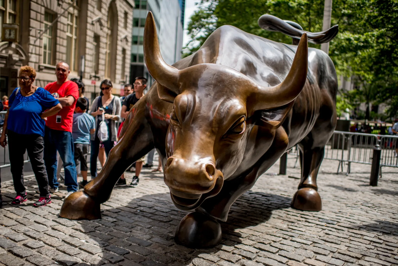 Tourists shown lining up to take a photo with the Charging Bull statue in Lower Manhattan in June 2012.