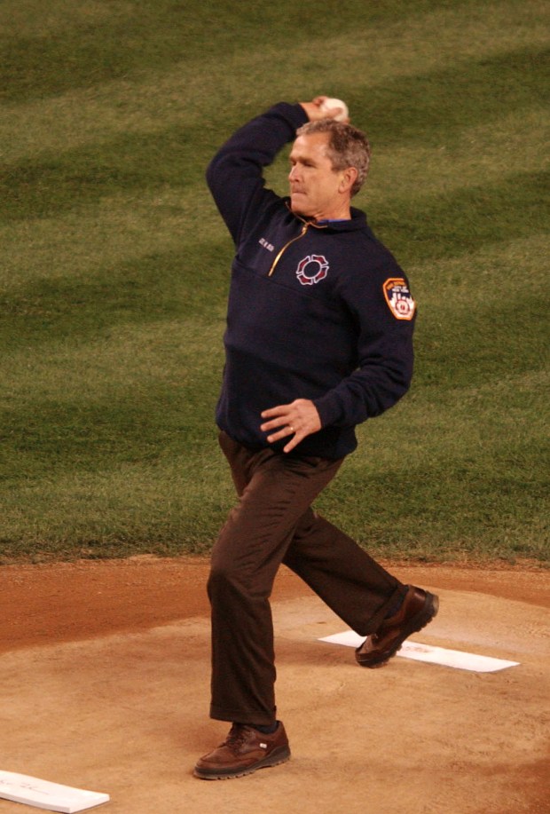 President George W. Bush throws out the ceremonial first pitch before game three of the World Series.