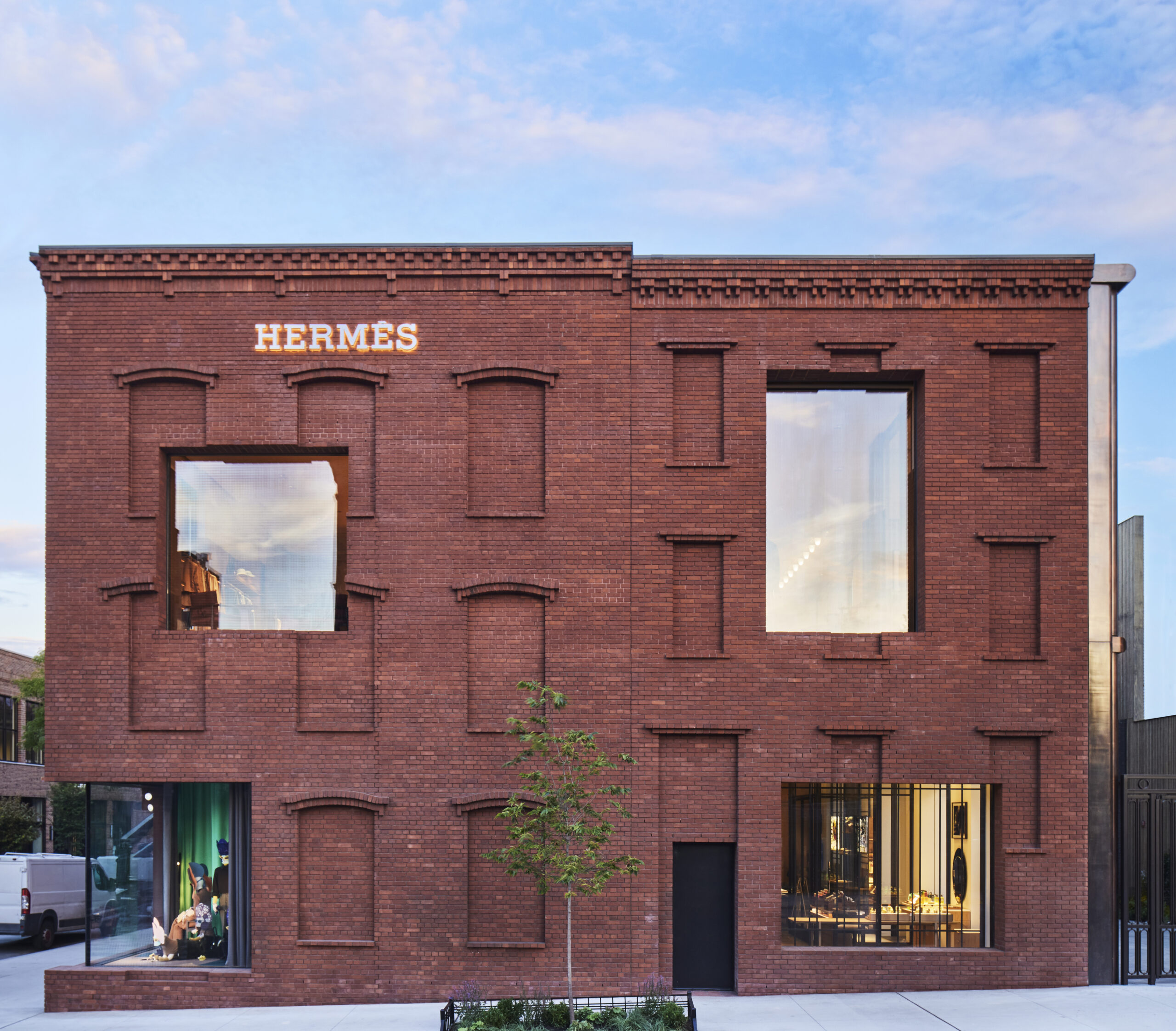 The exterior of the new Hermès Williamsburg store, including its brick facade and wide windows